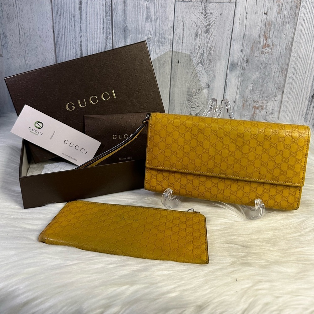 GUCCI guccissima leather wristlet wallet in mustard